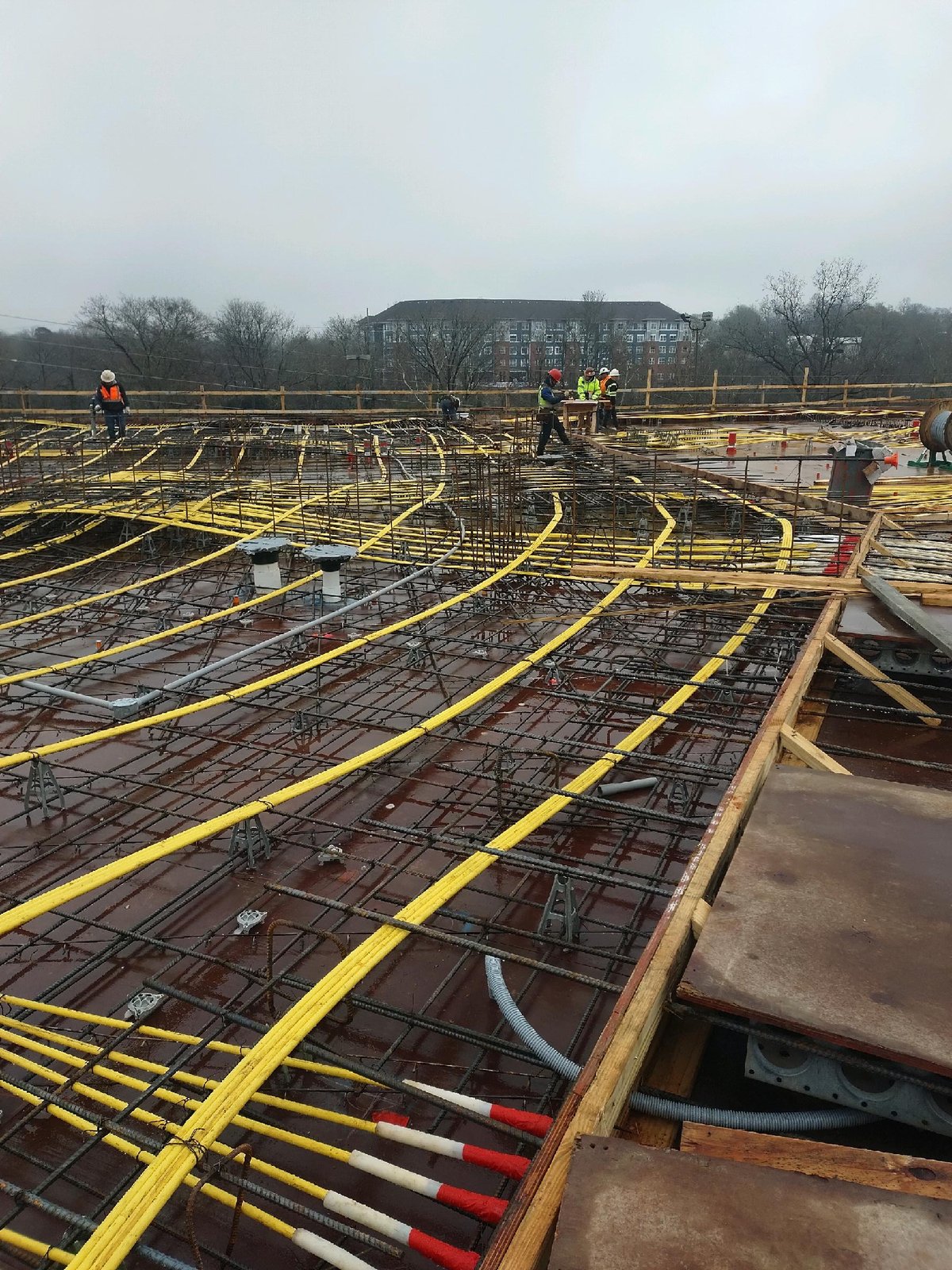 Post-tensioning tendons laid out on an elevated deck ready for the pour
